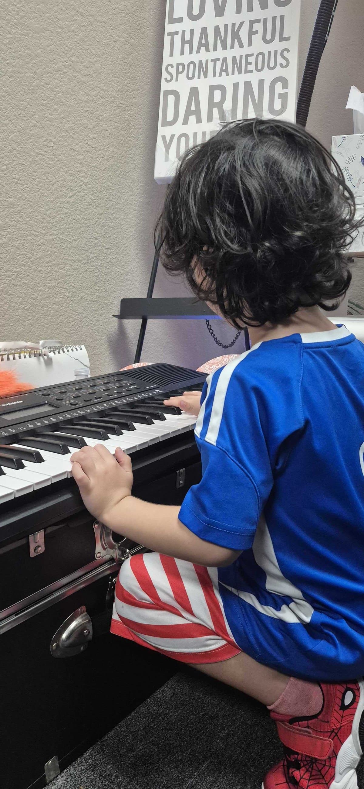 Students learning guitar together